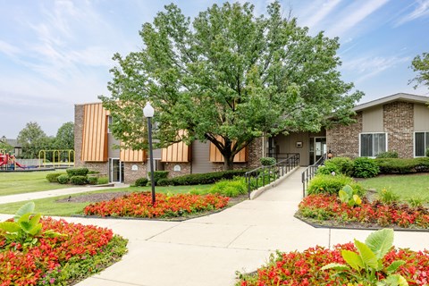 A building with a tree in front of it.