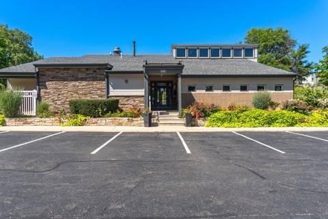 A building with a parking lot in front of it.