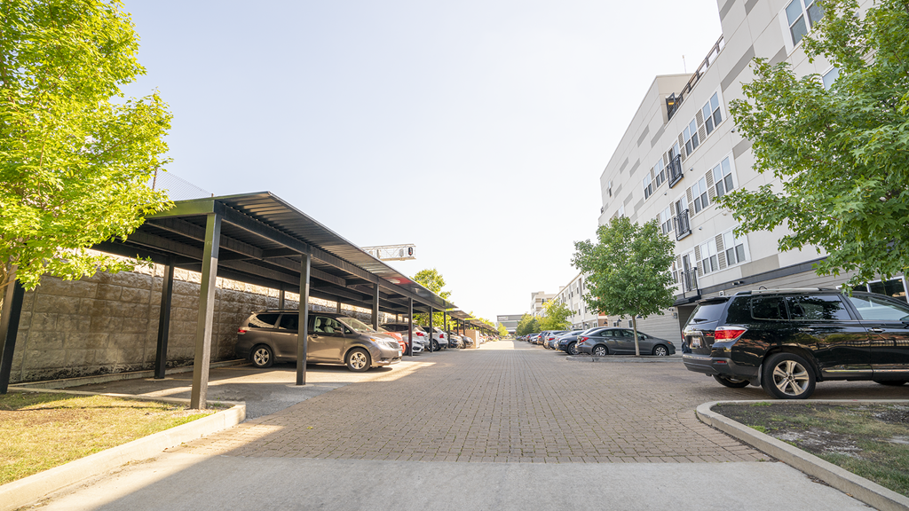 a city street with cars parked next to a building