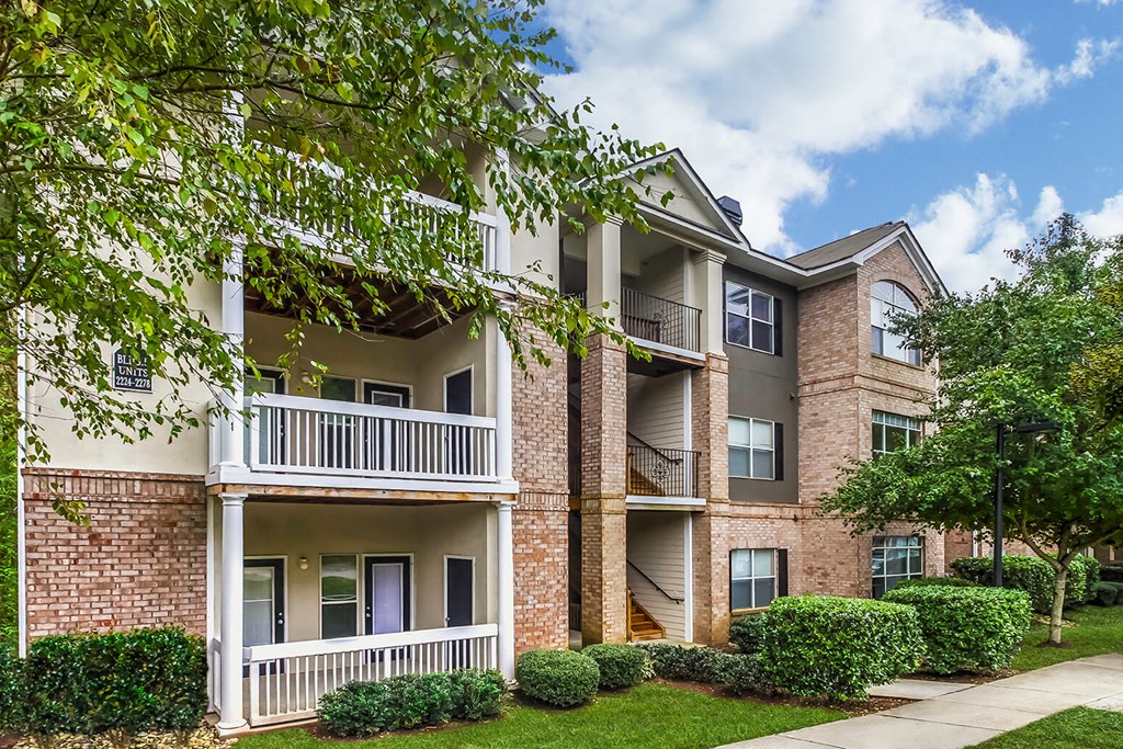 our apartments have a spacious courtyard with green grass and trees