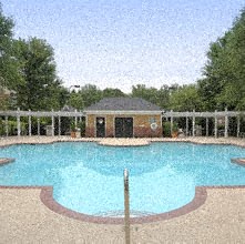 a large swimming pool with a fence around it