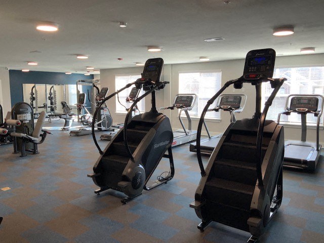 a gym with some exercise machines in it