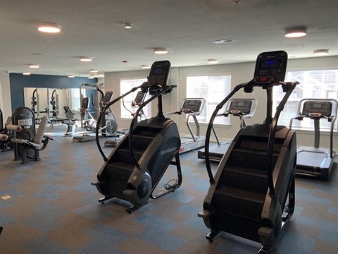 a gym with some exercise machines in it