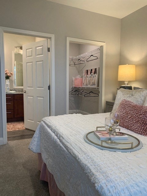 a bedroom with a bed and a table with a tray