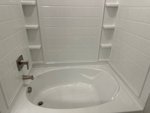 a white bathroom with a sink and a toilet