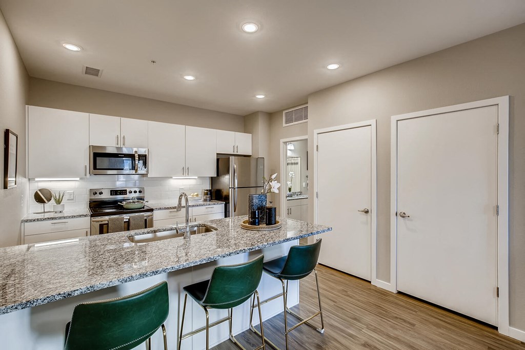 a kitchen with a granite counter top and a sink