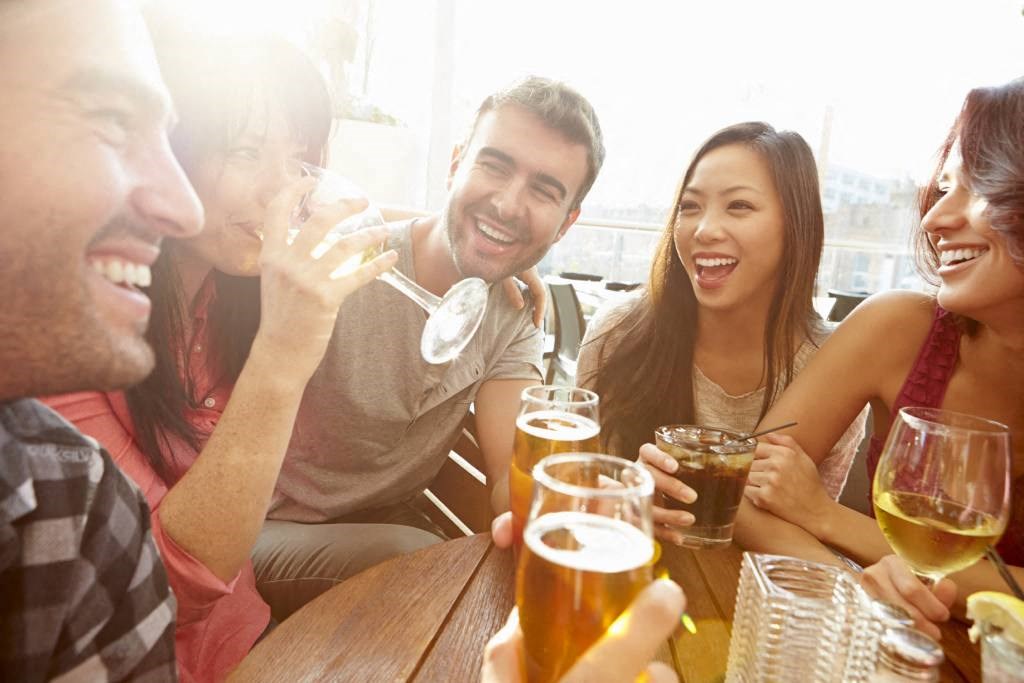 a group of people drinking beer
