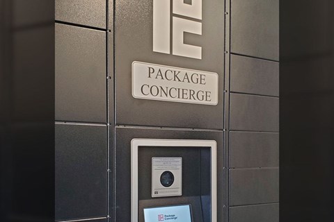 A package concierge sign is on a wall.