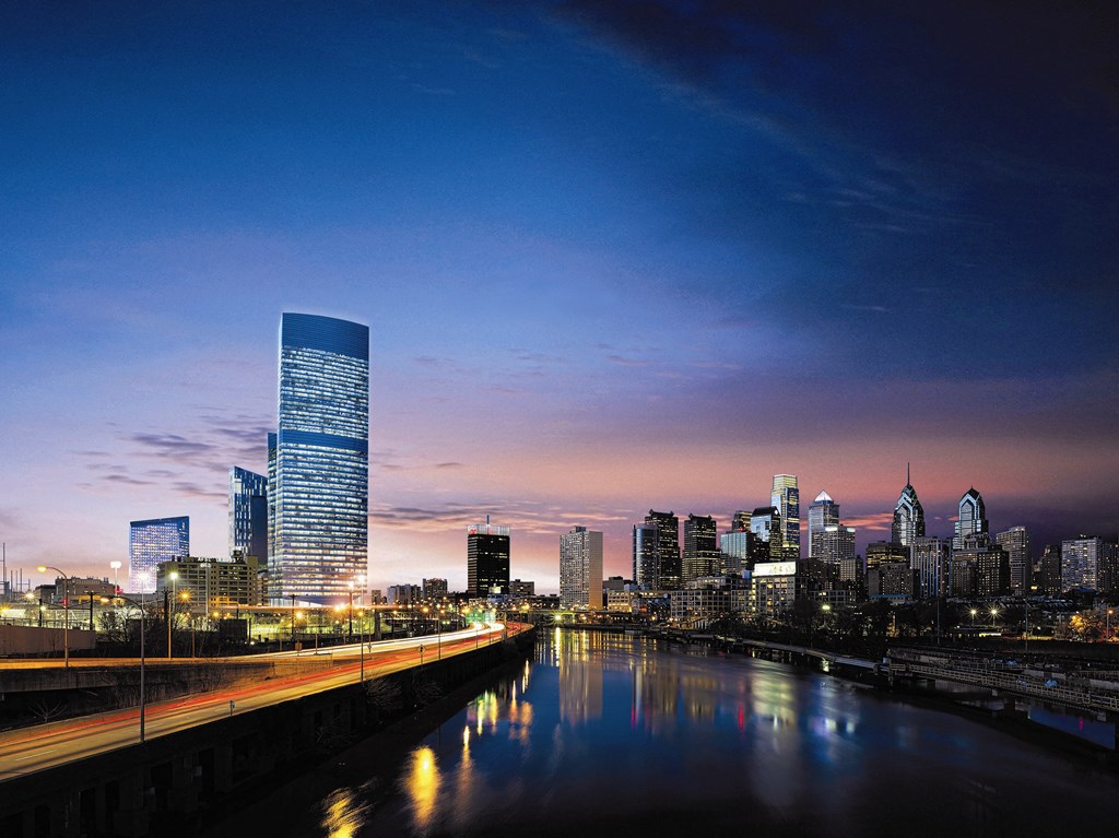 a city skyline at night with a river and a tall skyscraper