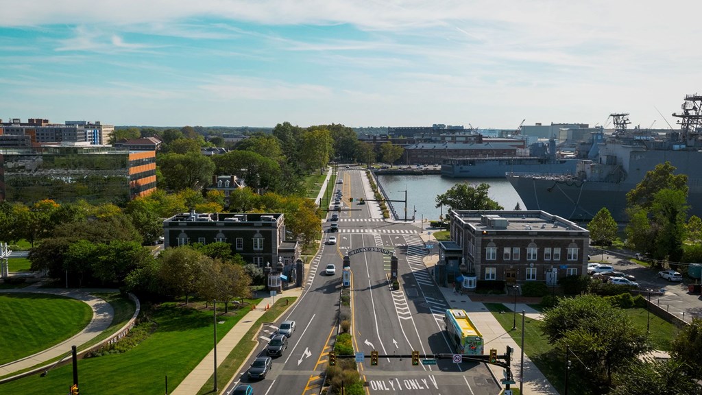 A view of a street with a traffic light and a sign that says "ONLY LANE".
