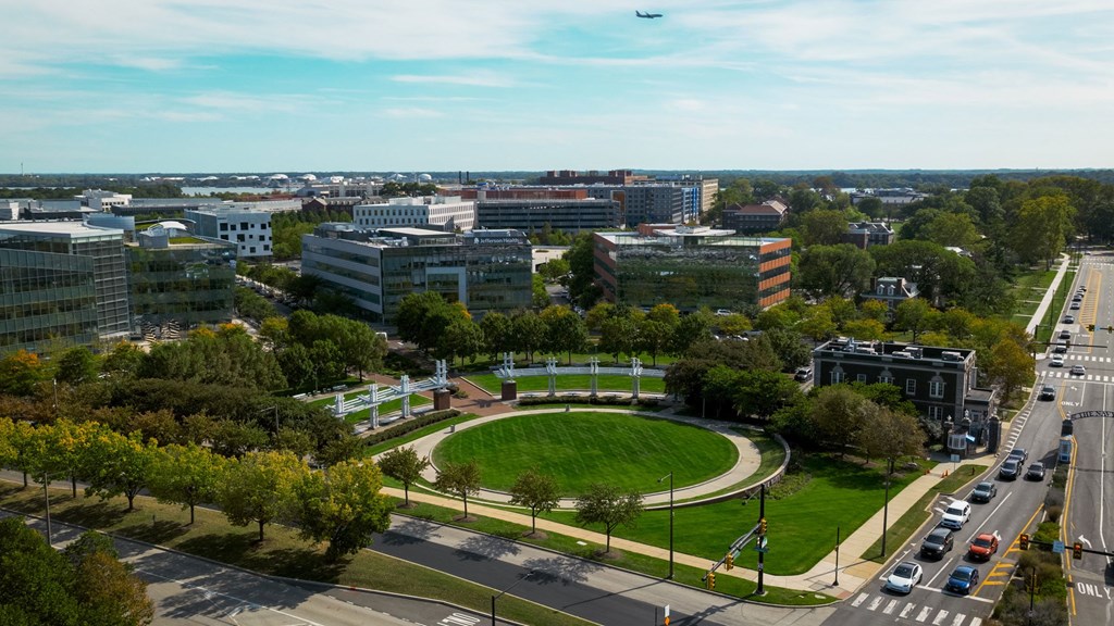 A cityscape with a large green park in the center.