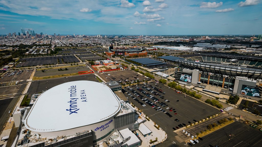 An aerial view of a stadium with the name Xfinity Modem Arena on it.