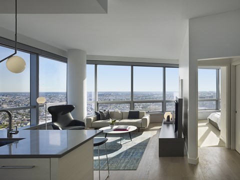 A modern living room with a view of the city.