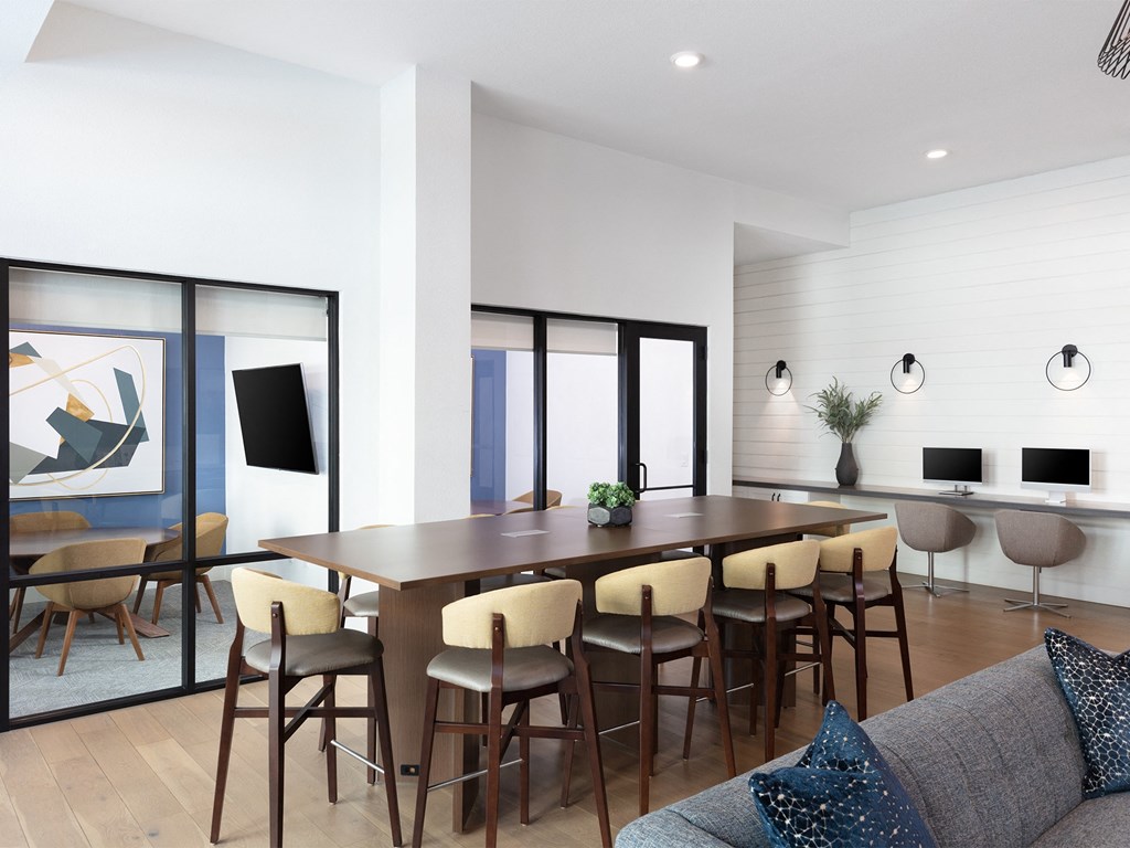 a rendering of a living room with a large table and chairs