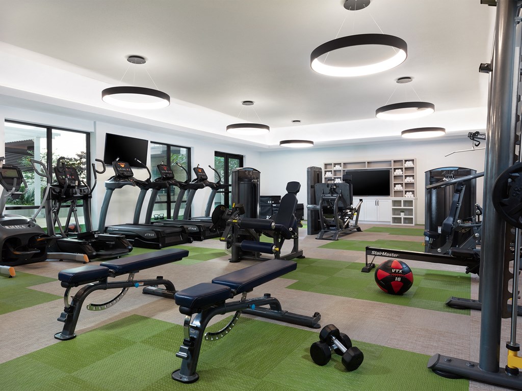 a room filled with lots of different types of exercise equipment