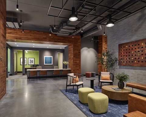 A modern office space with a wooden wall and a grey floor.