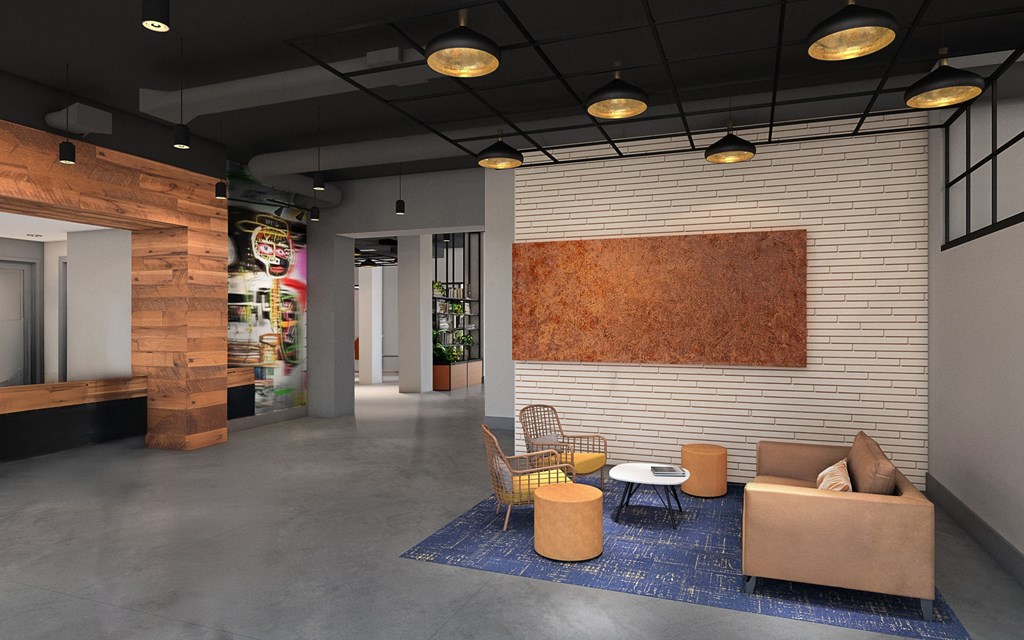 A modern living room with a wooden wall and a blue rug.