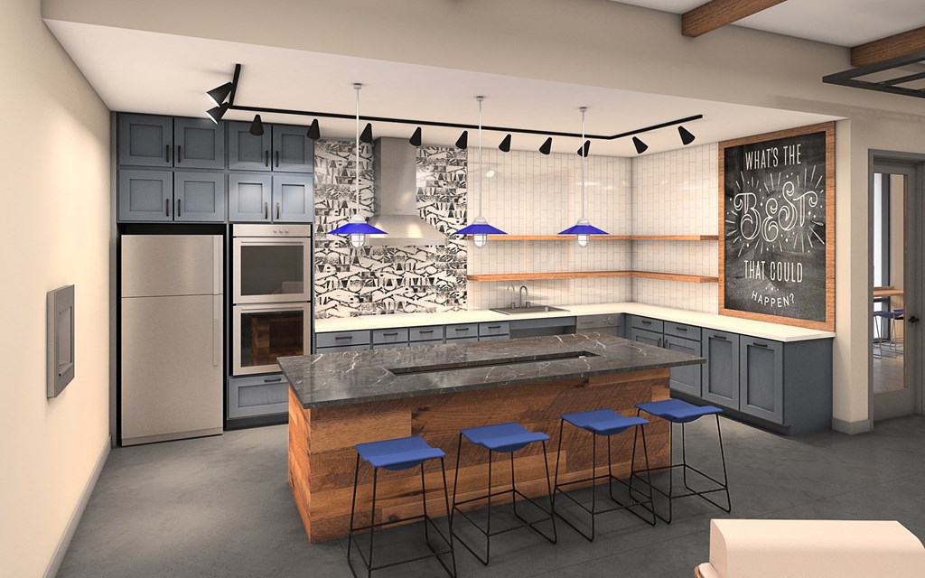 A kitchen with a bar area and a fridge.