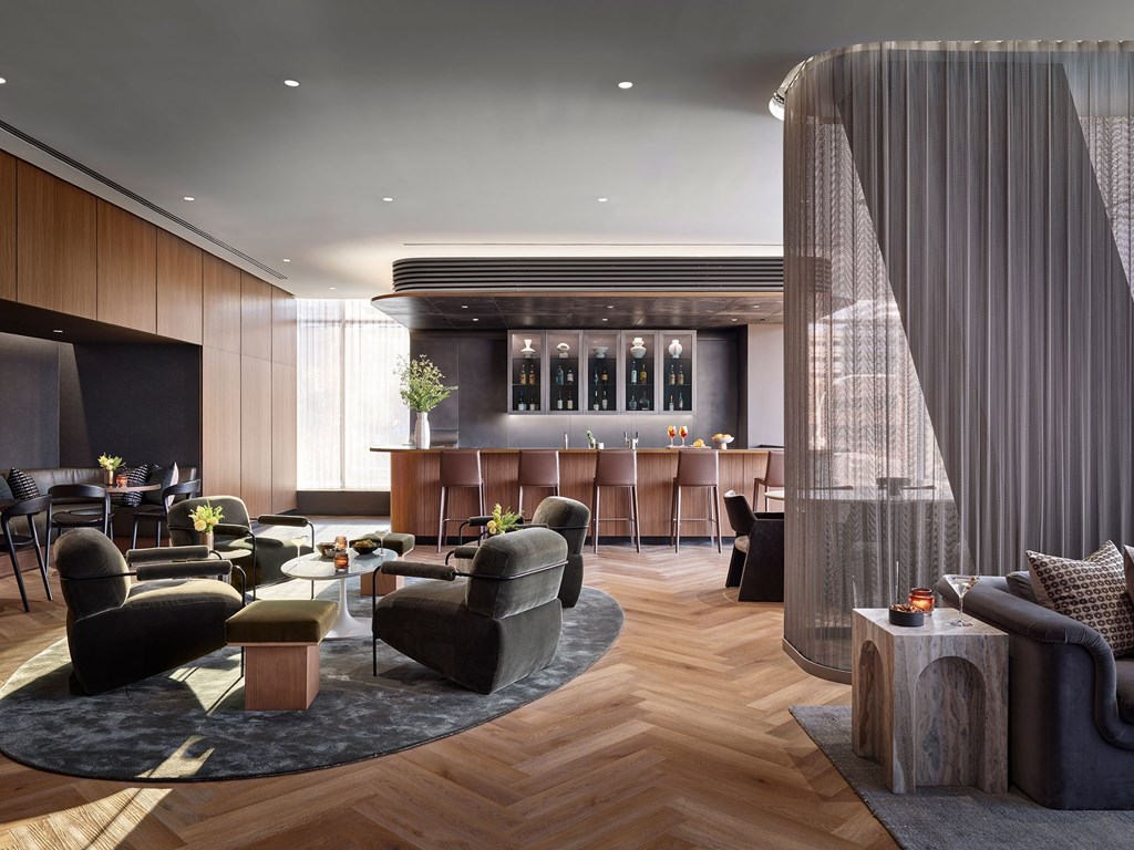 A modern living room with a curtain dividing the space.