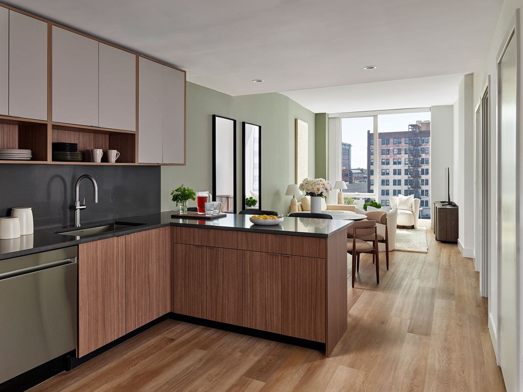 A modern kitchen with wooden cabinets and a large island.