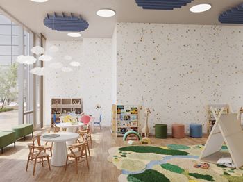 A room with a white table surrounded by chairs and a wall with a pattern of small objects.