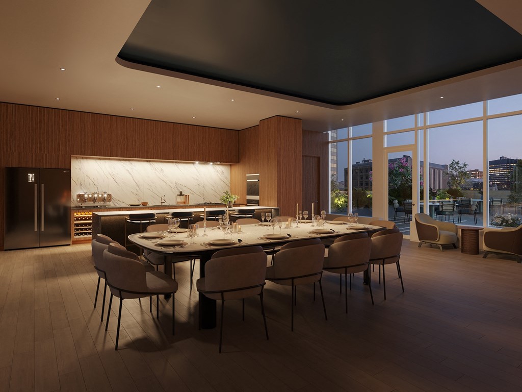A modern dining room with a large table and chairs.