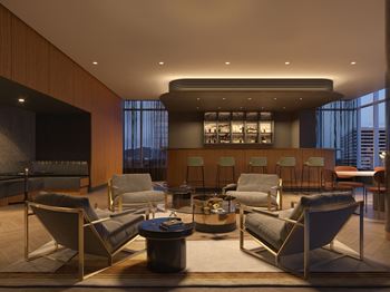 A modern living room with a large window and a view of the city.