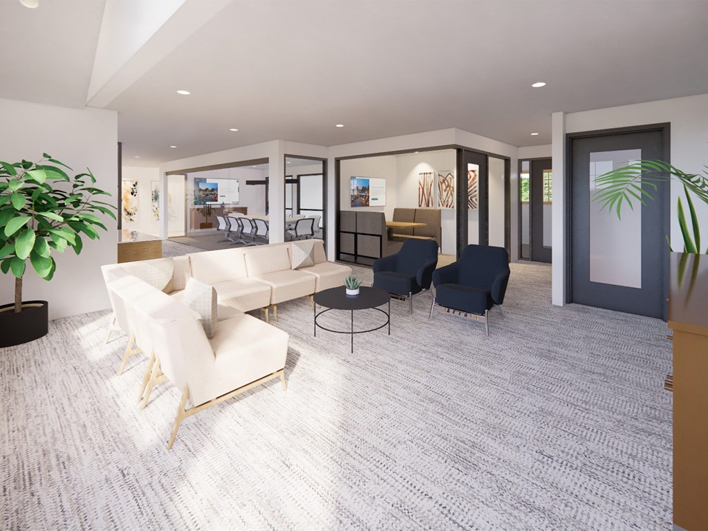 a living room with a white couch and chairs