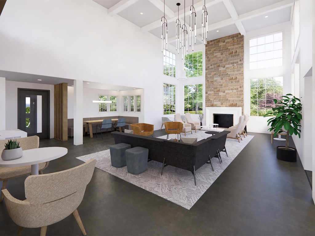 a large living room with a large table and chairs and a fireplace