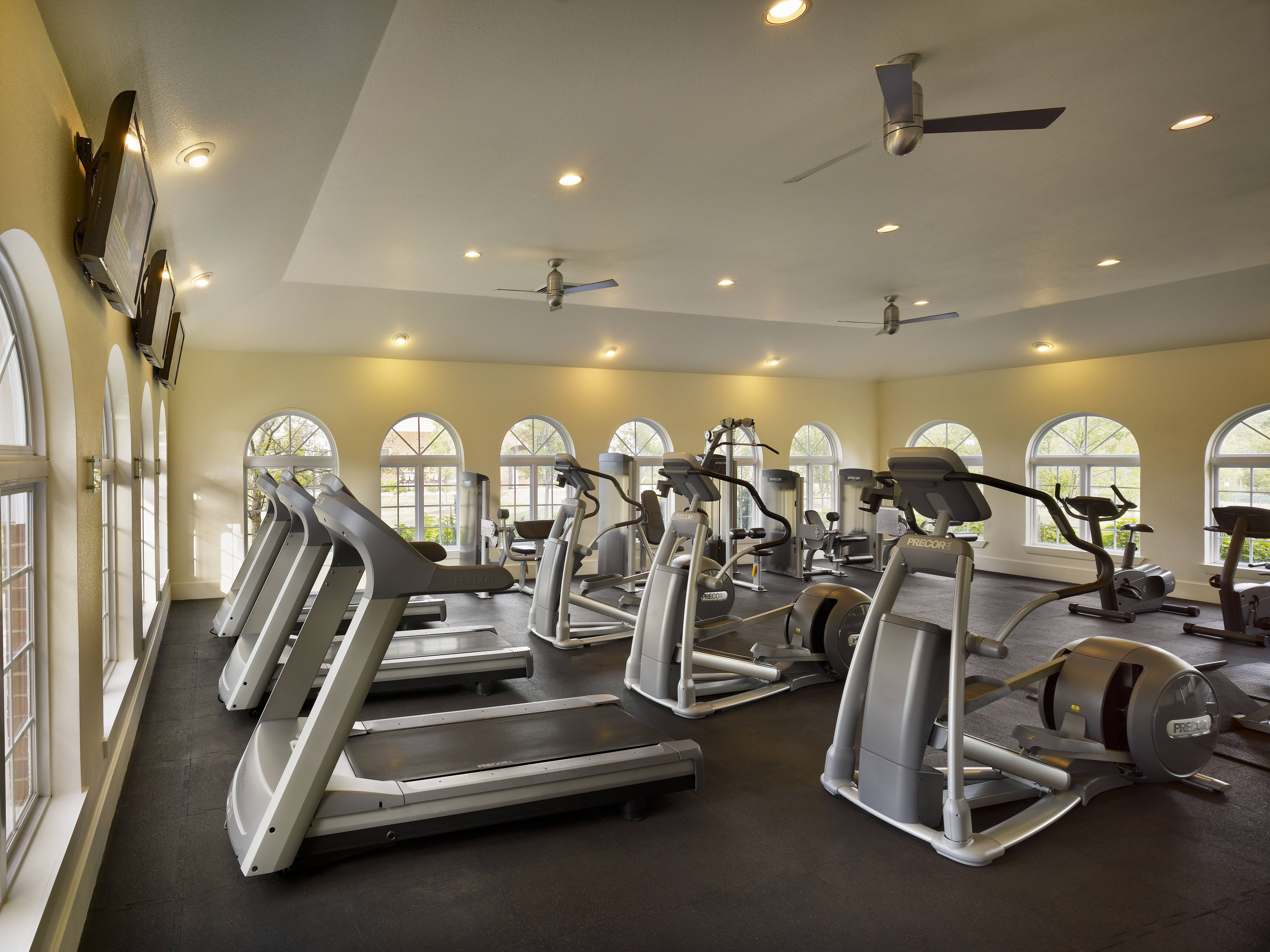 A gym with treadmills and exercise equipment.