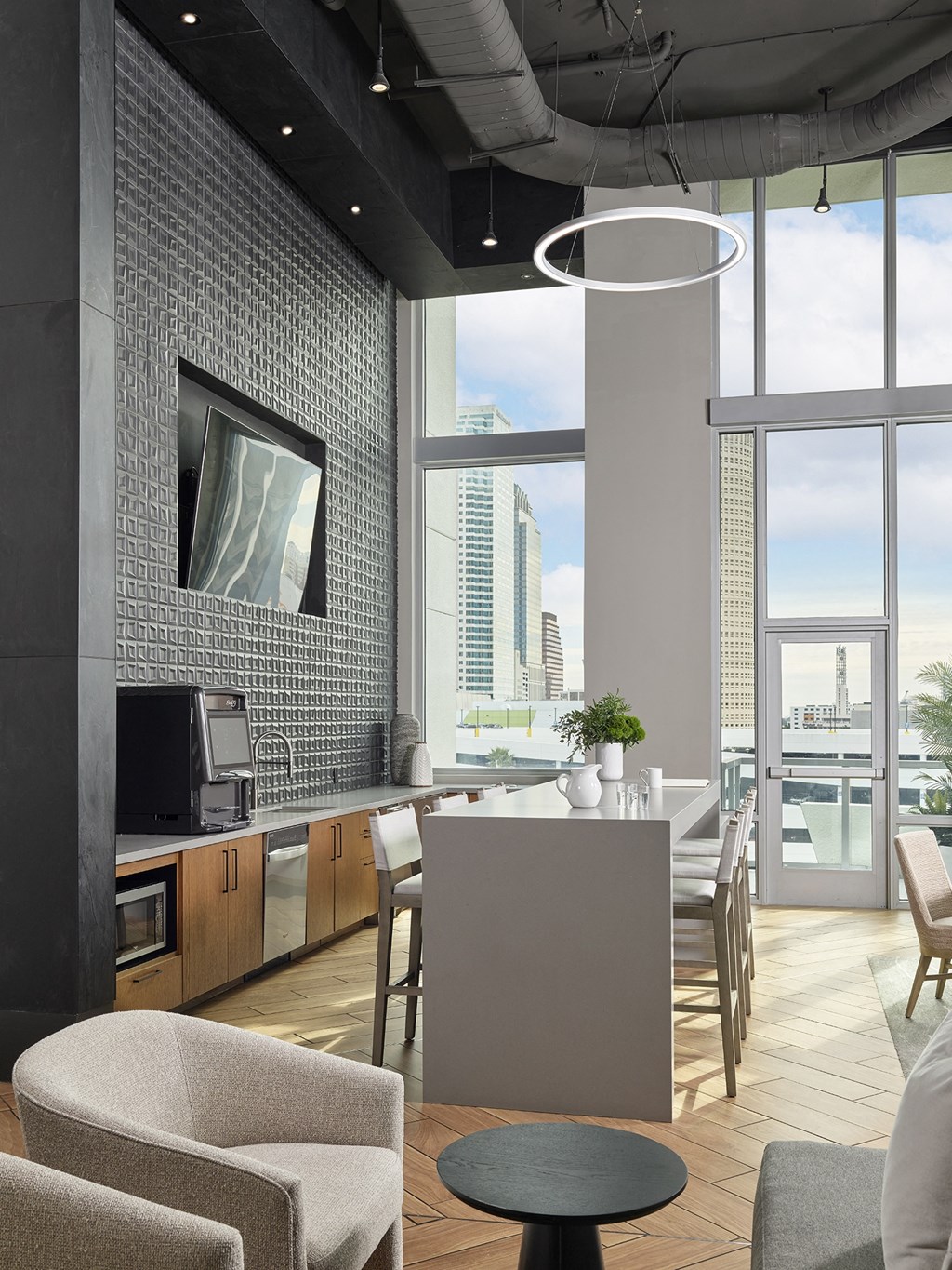 A modern kitchen with a view of the city.