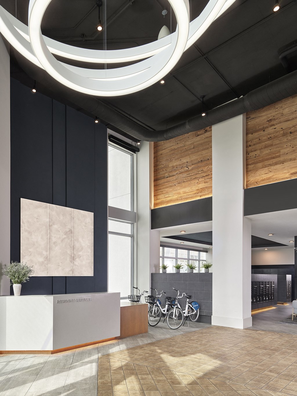 A reception area with a white reception desk and a bicycle rack.