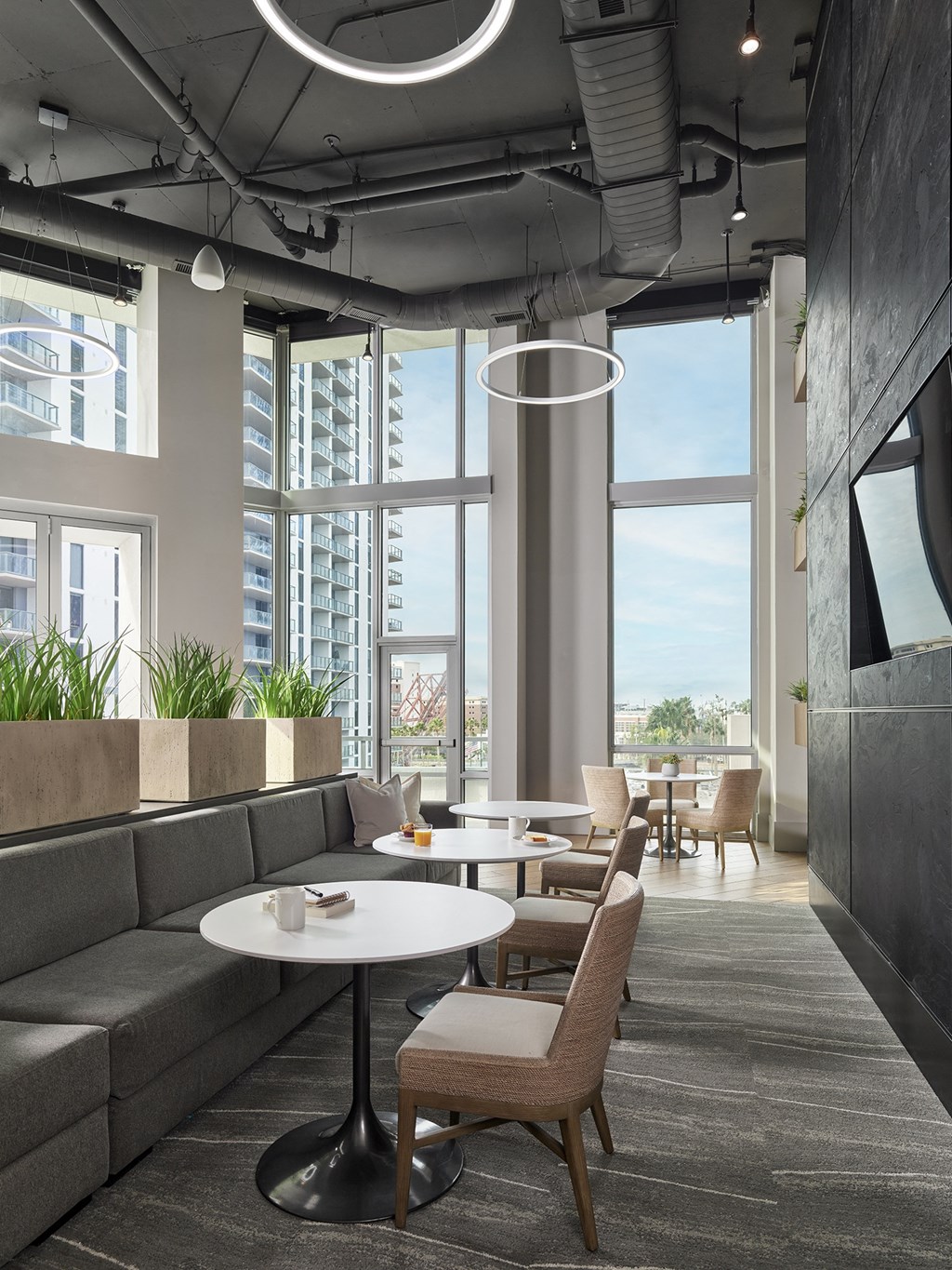 A modern dining area with a table and chairs.
