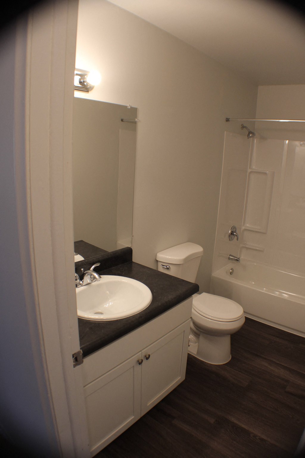 a small bathroom with a sink toilet and shower