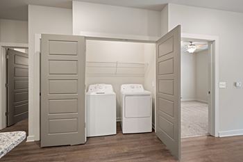 a laundry room with washers at The Augustan, Augusta, 30901