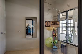 a room with a large window and a sculpture in the middle of it at The Augustan, Augusta, GA