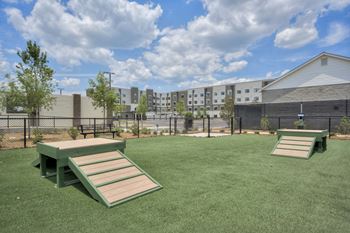our apartments have a spacious dog park with picnic tables at The Augustan, Augusta, GA