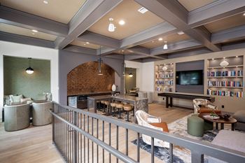 a clubhouse with a library and a pool table at The Augustan, Augusta