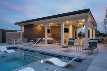 the pool and patio area of a house with a swimming pool at The Augustan, Augusta