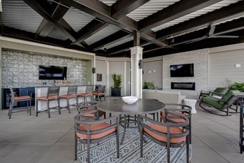 a dining area with a table and chairs and a fireplace at The Augustan, Georgia
