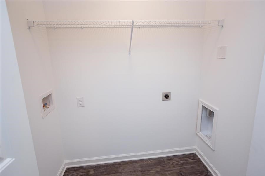 a empty room with a white wall and a window