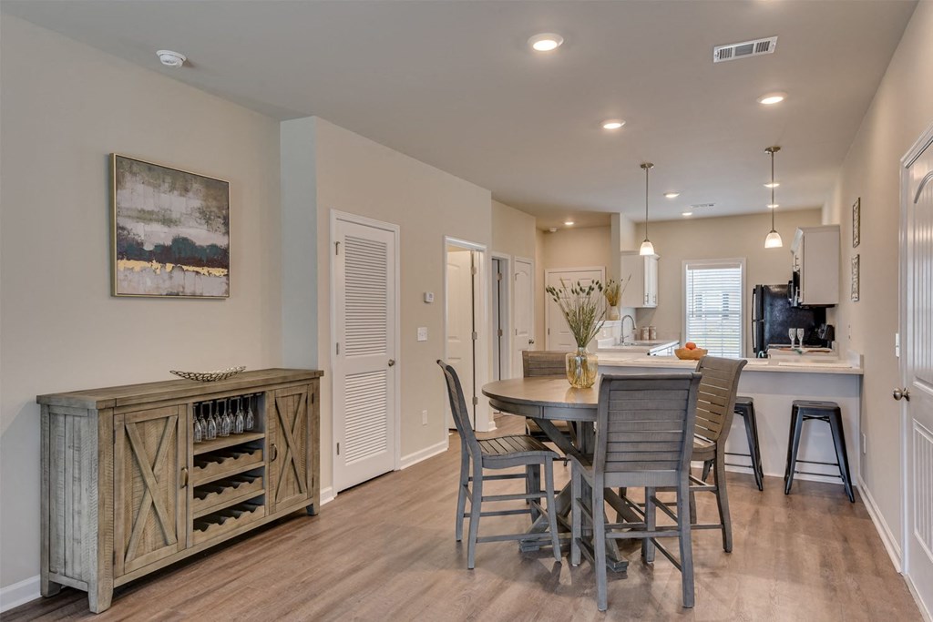 a kitchen and dining room with a table and chairs