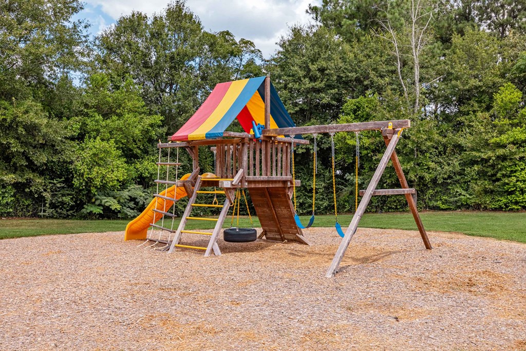 Playground with swings and slide at Sterlington Apartments, Georgia, 30813