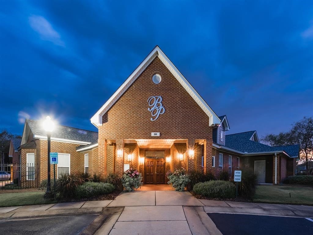 the building where the hotel is located is lit up at night