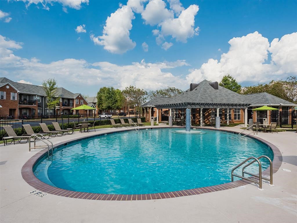 the swimming pool at the resort on a sunny day