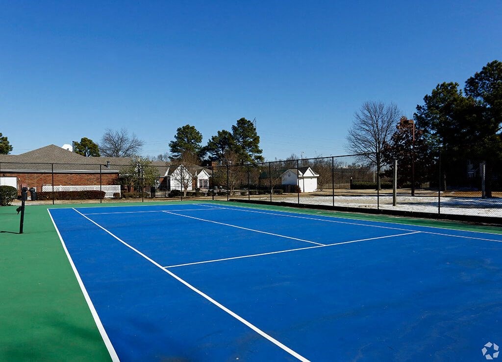 a blue tennis court with white lines on it