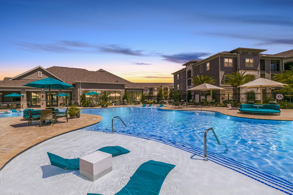 Pool And Sundeck at Cue Luxury Apartments, Cypress, TX, 77433