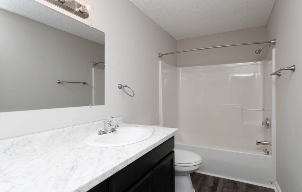 A white sink with a marble countertop in a bathroom at Diamond Townhomes, Beaufort, SC 29906