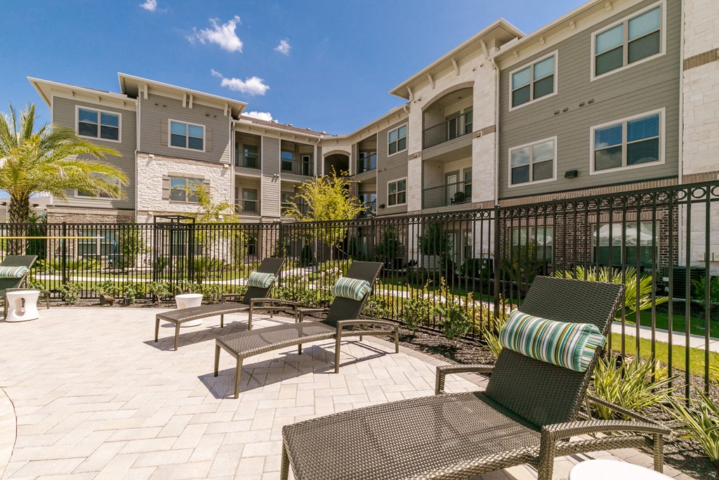 Poolside Sundecks at Cue Luxury Apartments, Cypress