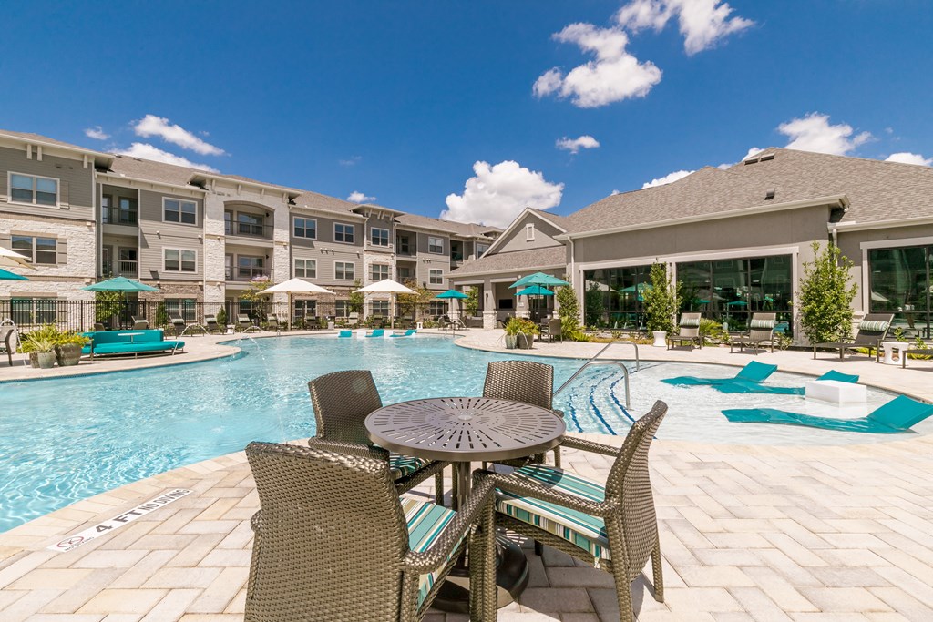 Poolside Dining Table at Cue Luxury Apartments, Cypress, TX, 77433